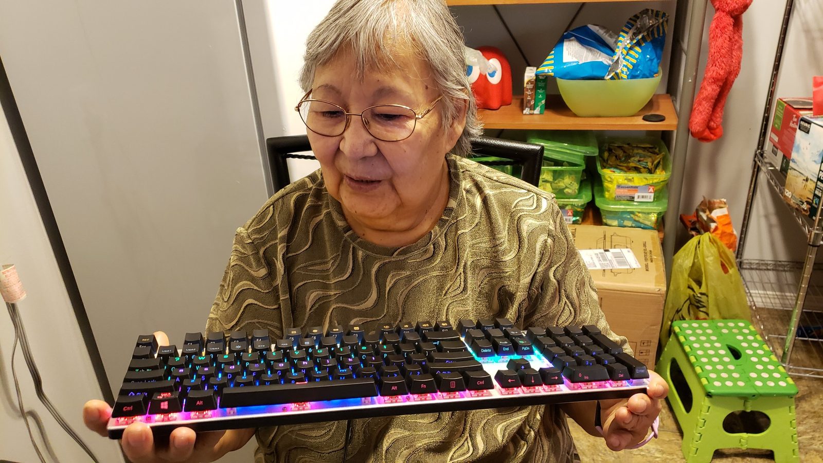 Elder Carol Estralshenen holding the backlit FN Keys Dene keyboard